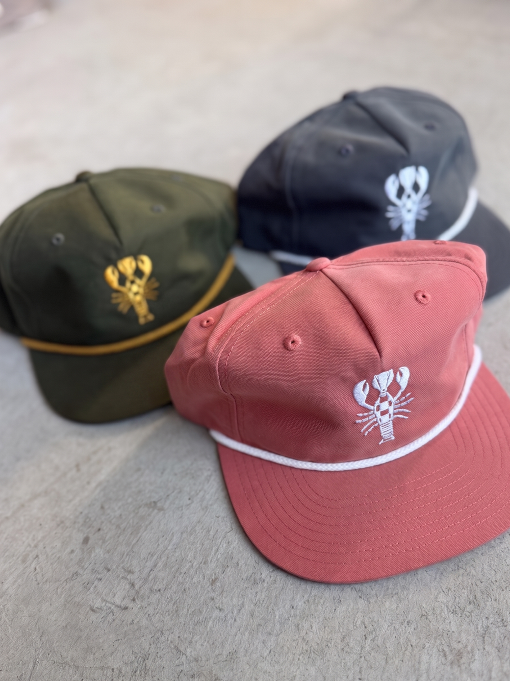 Marsh Green, Driftwood Gray, and Washed Coral Lobster Snapbacks