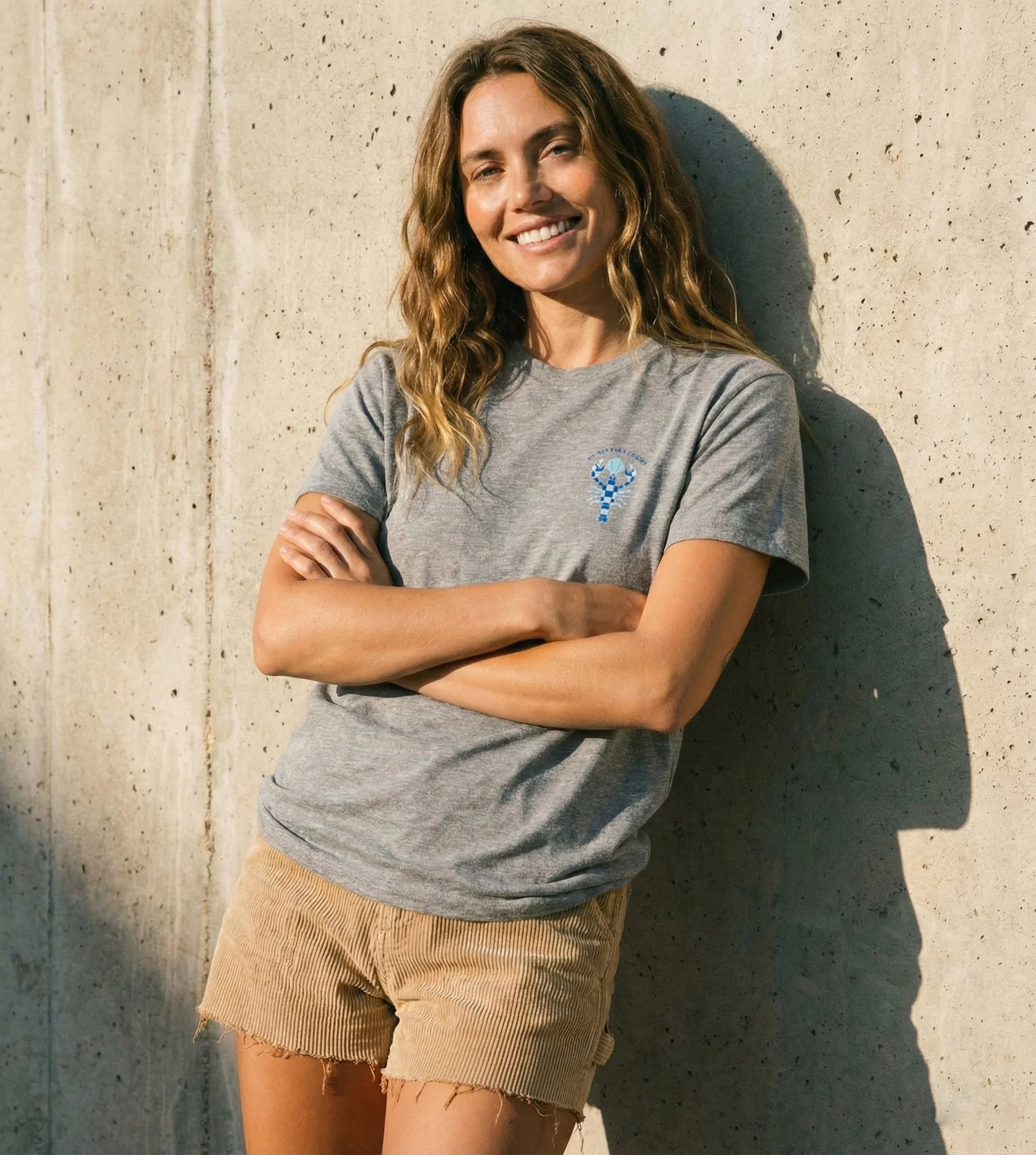 Front of the Heather Grey Unisex Drift Tee with the small Checkered Lobster at the chest