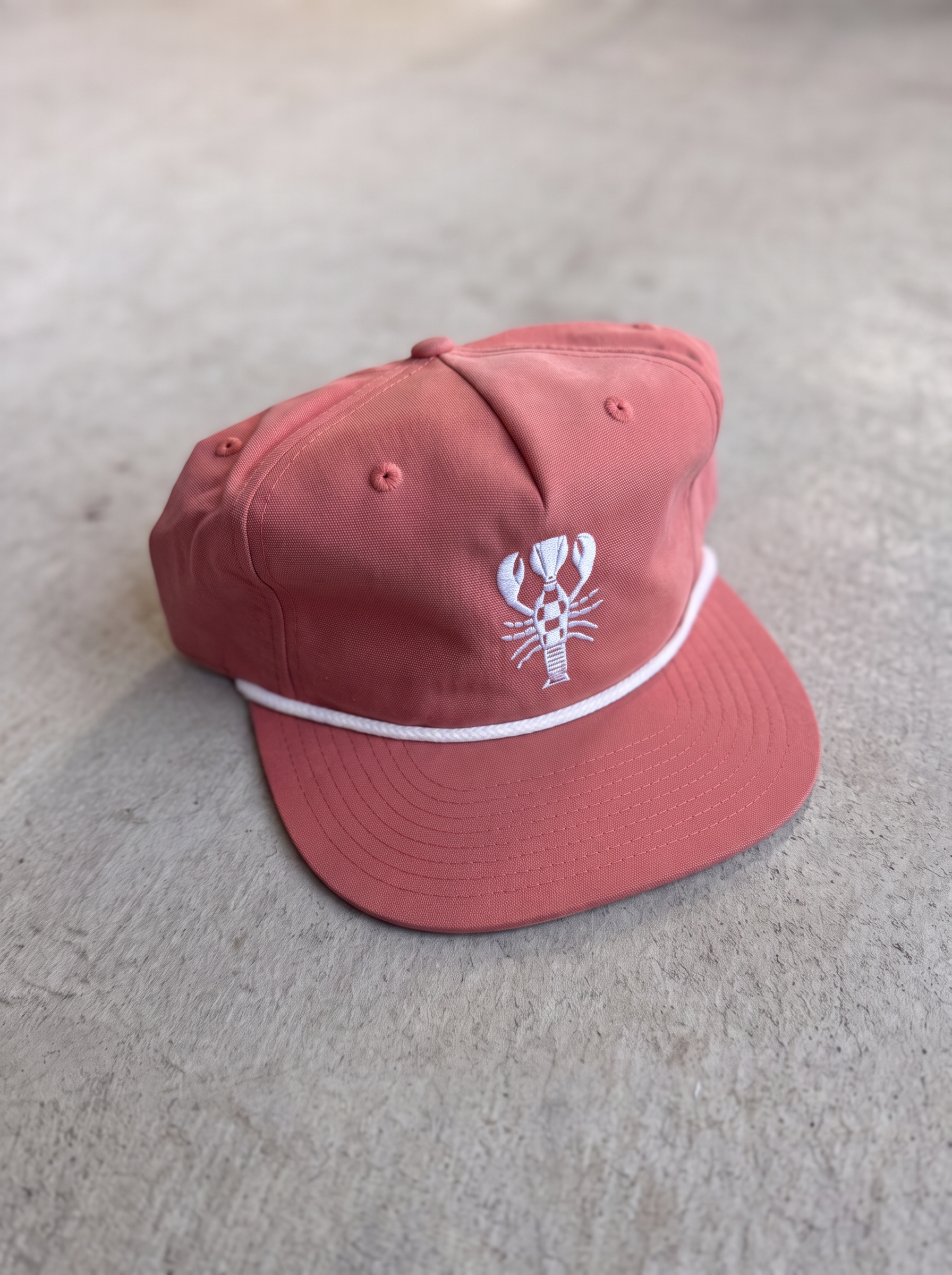Nantucket Red rope cap with white rope brim and embroidered lobster