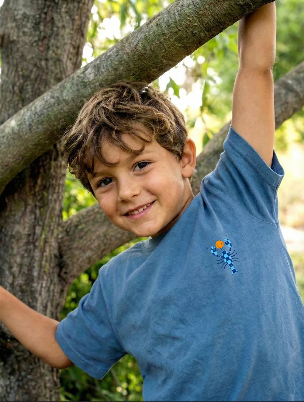 Kid wearing the Washed Denim Classic TCL Unisex Tee
